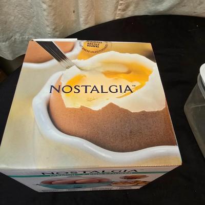 Plastic food storage containers with a Rapid Mac cooker - Nostalgia mini 7 egg cooker - a tiered serving tray and a new knife
