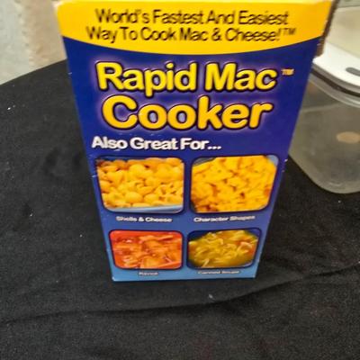 Plastic food storage containers with a Rapid Mac cooker - Nostalgia mini 7 egg cooker - a tiered serving tray and a new knife