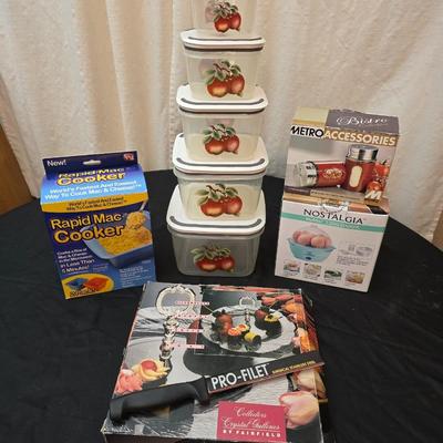 Plastic food storage containers with a Rapid Mac cooker - Nostalgia mini 7 egg cooker - a tiered serving tray and a new knife