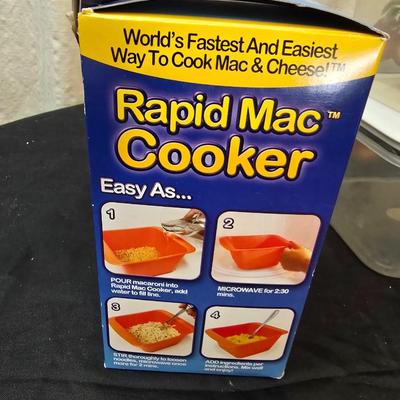 Plastic food storage containers with a Rapid Mac cooker - Nostalgia mini 7 egg cooker - a tiered serving tray and a new knife