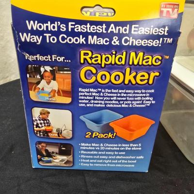 Plastic food storage containers with a Rapid Mac cooker - Nostalgia mini 7 egg cooker - a tiered serving tray and a new knife