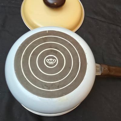 Soup pot with two covered soup bowls and a beautiful metal bread pan