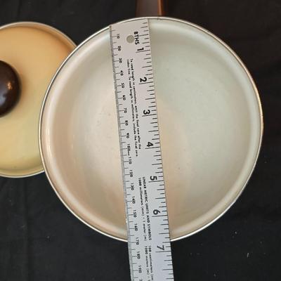 Soup pot with two covered soup bowls and a beautiful metal bread pan
