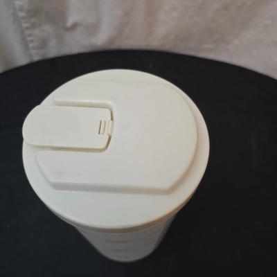 Perfect for morning fruit shakes! Cuisinart drink mixer with some plastic cups and plastic containers for fluids
