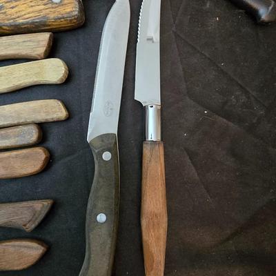 Collection of Kitchen knives, cutting boards, and an electric knife sharppener