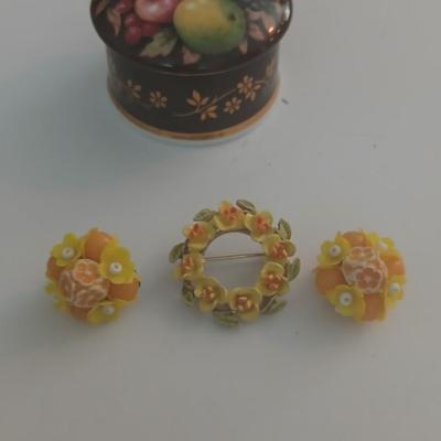 Ceramic trinket box with vintage brooch, earrings and more