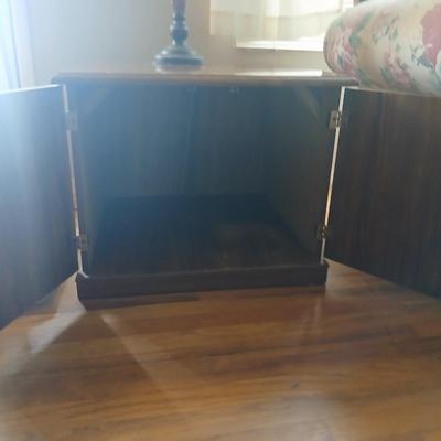 End table with under storage and a beautiful table lamp