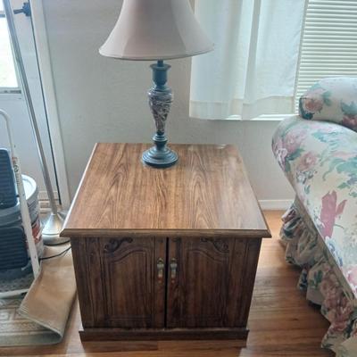 End table with under storage and a beautiful table lamp