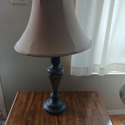End table with under storage and a beautiful table lamp