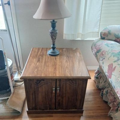 End table with under storage and a beautiful table lamp