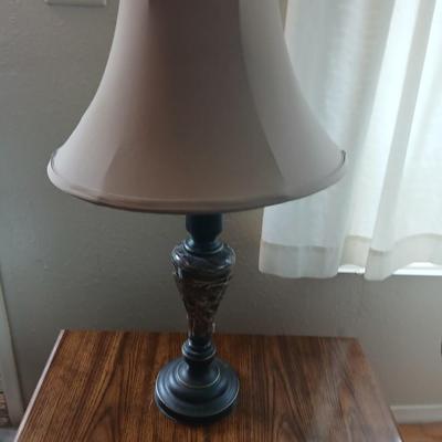 End table with under storage and a beautiful table lamp