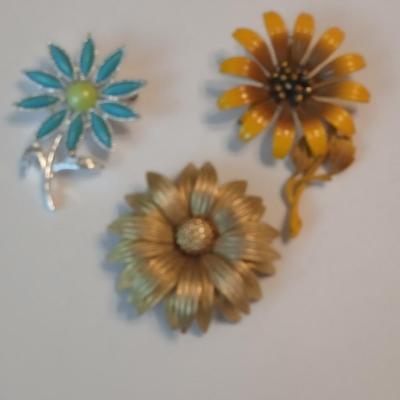 Three vintage flower brooch pins