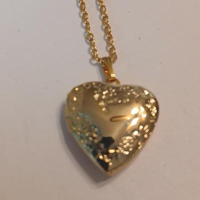 Three gold toned lockets
