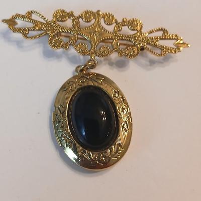 Three gold toned lockets