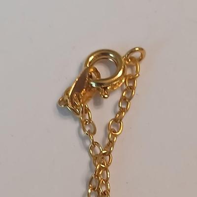 Three gold toned lockets