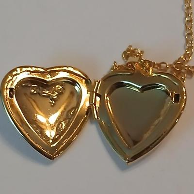Three gold toned lockets