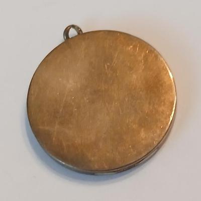 Three gold toned lockets