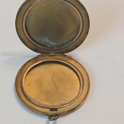 Three gold toned lockets