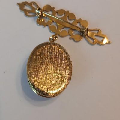 Three gold toned lockets