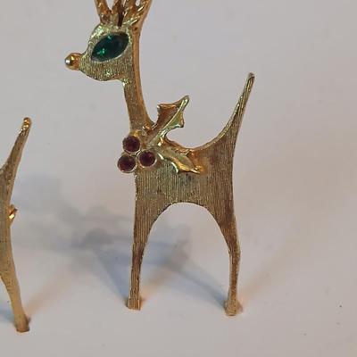 Two vintage reindeer pins with gemstones