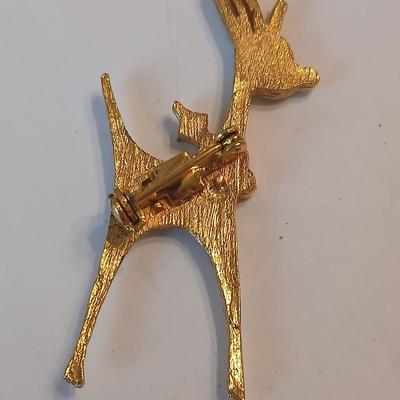 Two vintage reindeer pins with gemstones