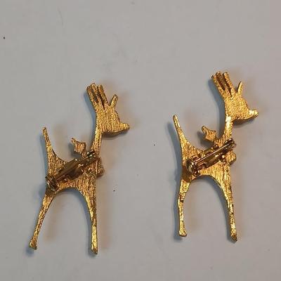 Two vintage reindeer pins with gemstones