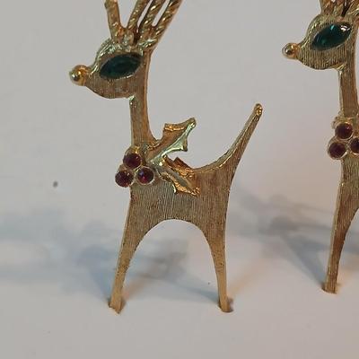 Two vintage reindeer pins with gemstones