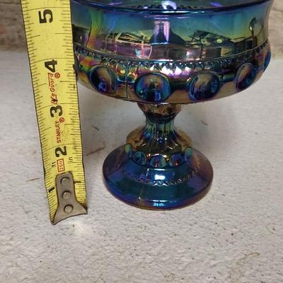 Sale Photo Thumbnail #207: Great lot of glassware. Swedish pulled vase, blue carnival kings crown compote, gorgeous smoke carnival Imperial 3-toed bowl. And a glass bread tray.