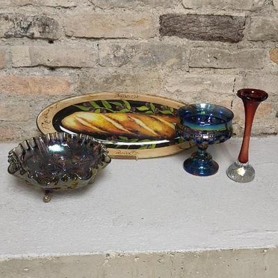Sale Photo Thumbnail #199: Great lot of glassware. Swedish pulled vase, blue carnival kings crown compote, gorgeous smoke carnival Imperial 3-toed bowl. And a glass bread tray.