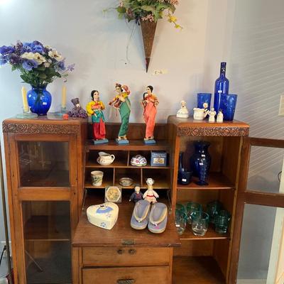 Sale Photo Thumbnail #19: Antique Cabinet/Desk
Asian Dolls, Blue Glass and more.