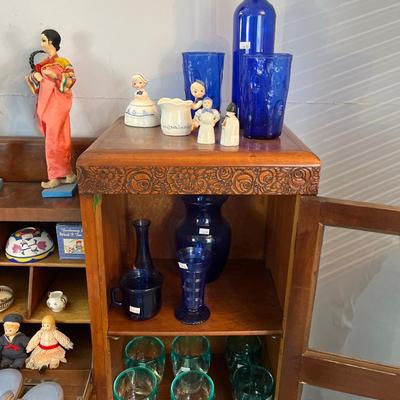 Sale Photo Thumbnail #21: Antique Cabinet/Desk
Asian Dolls, Blue Glass and more.