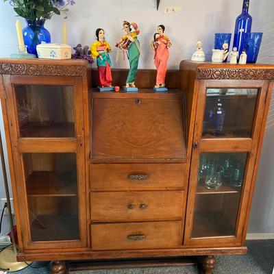 Sale Photo Thumbnail #24: Antique Cabinet/Desk
Asian Dolls, Blue Glass and more.