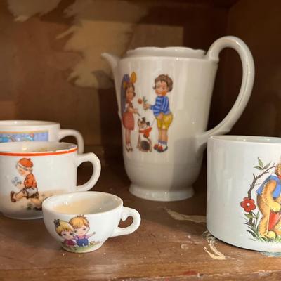 Sale Photo Thumbnail #65: Children’s Dishes Cups, plates, Silverware

Bakers rack not included