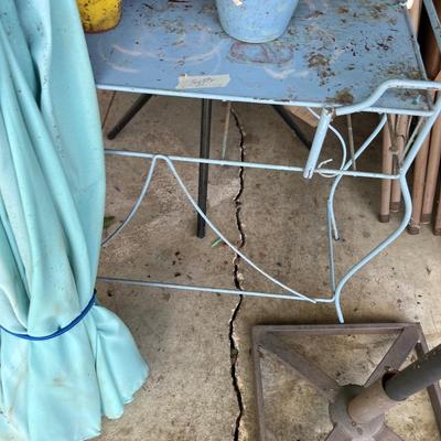 Sale Photo Thumbnail #188: Outdoor umbrella, metal table and wall planters.
