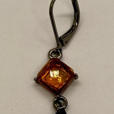 Sale Photo Thumbnail #11: For pierced ears, has a diamond-shaped translucent amber stone above a dark teardrop. Good condition.
