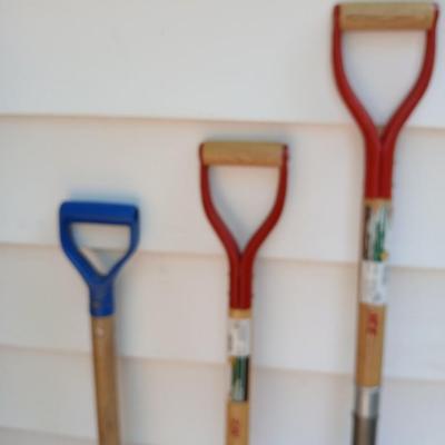 Three short, handled hand tools - Shovel - Digging fork - and a Drain Spade