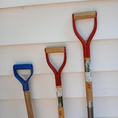 Three short, handled hand tools - Shovel - Digging fork - and a Drain Spade