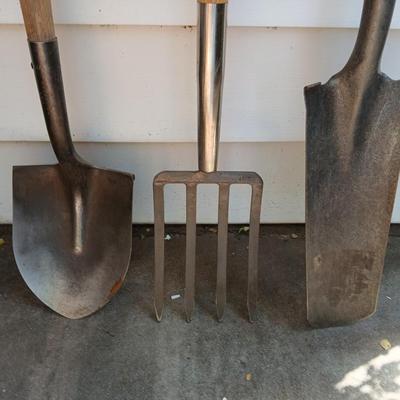 Three short, handled hand tools - Shovel - Digging fork - and a Drain Spade