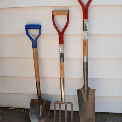 Three short, handled hand tools - Shovel - Digging fork - and a Drain Spade