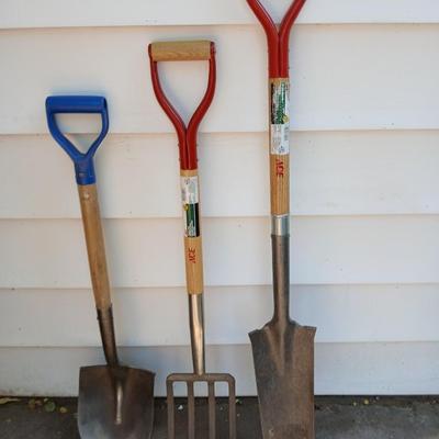 Three short, handled hand tools - Shovel - Digging fork - and a Drain Spade