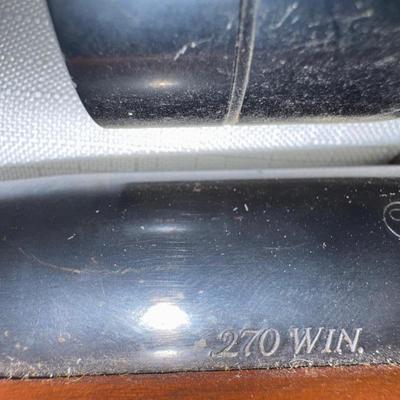 Sale Photo Thumbnail #3: Ruger M77 single bolt action rifle. 270 WIN. 22-inch barrel with a Tasco scope. Will need a good cleaning since it’s dusty.