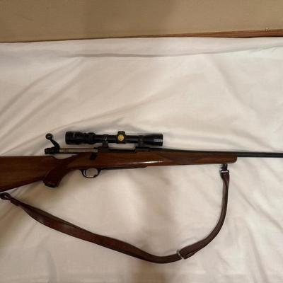Sale Photo Thumbnail #5: Ruger M77 single bolt action rifle. 270 WIN. 22-inch barrel with a Tasco scope. Will need a good cleaning since it’s dusty.
