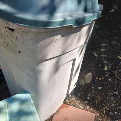 Large sized rolling garbage bin with several smaller plastic trash cans / containers