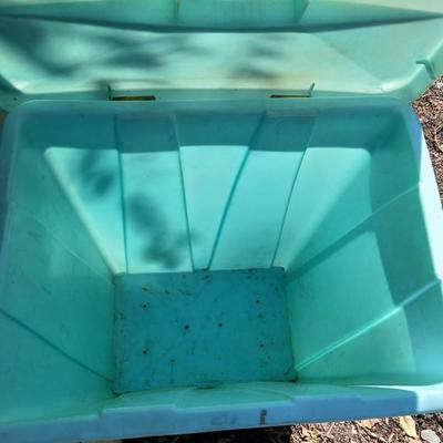 Large sized rolling garbage bin with several smaller plastic trash cans / containers