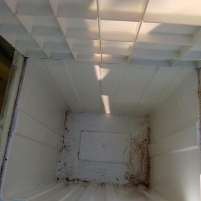 Large sized rolling garbage bin with several smaller plastic trash cans / containers