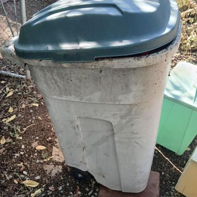 Large sized rolling garbage bin with several smaller plastic trash cans / containers