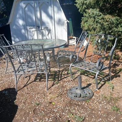 Martha Stewart patio table with etched glass and lazy susan comes with 5 metal chairs and weighted umbrella stand