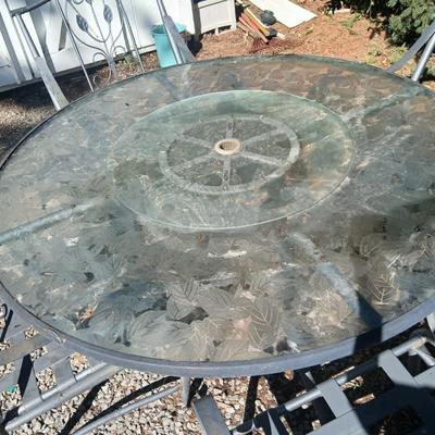 Martha Stewart patio table with etched glass and lazy susan comes with 5 metal chairs and weighted umbrella stand