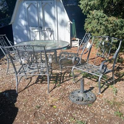 Martha Stewart patio table with etched glass and lazy susan comes with 5 metal chairs and weighted umbrella stand