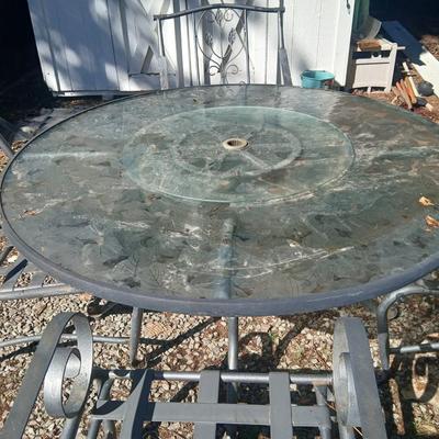 Martha Stewart patio table with etched glass and lazy susan comes with 5 metal chairs and weighted umbrella stand